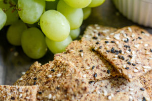 almond crackers closeup with green grapes