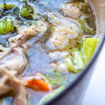 Homemade Chicken Stock in a cast iron pot