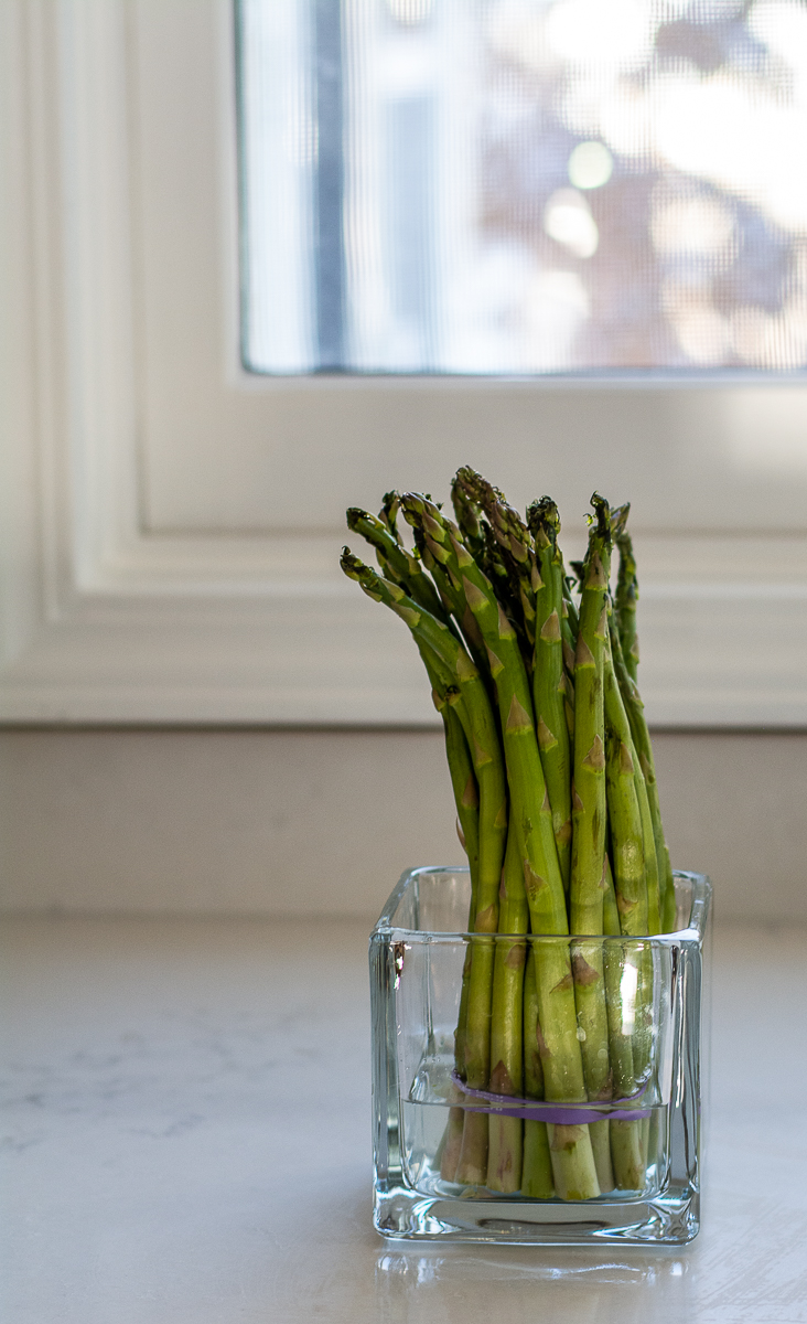 asparagus in a glass vase with water